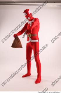 JOEL_ADAMSON CHRISTMAS VALLAIN WITH GUN AND BAG